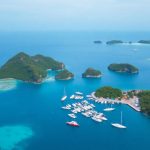 Labuan Bajo harbor with islands and boats.